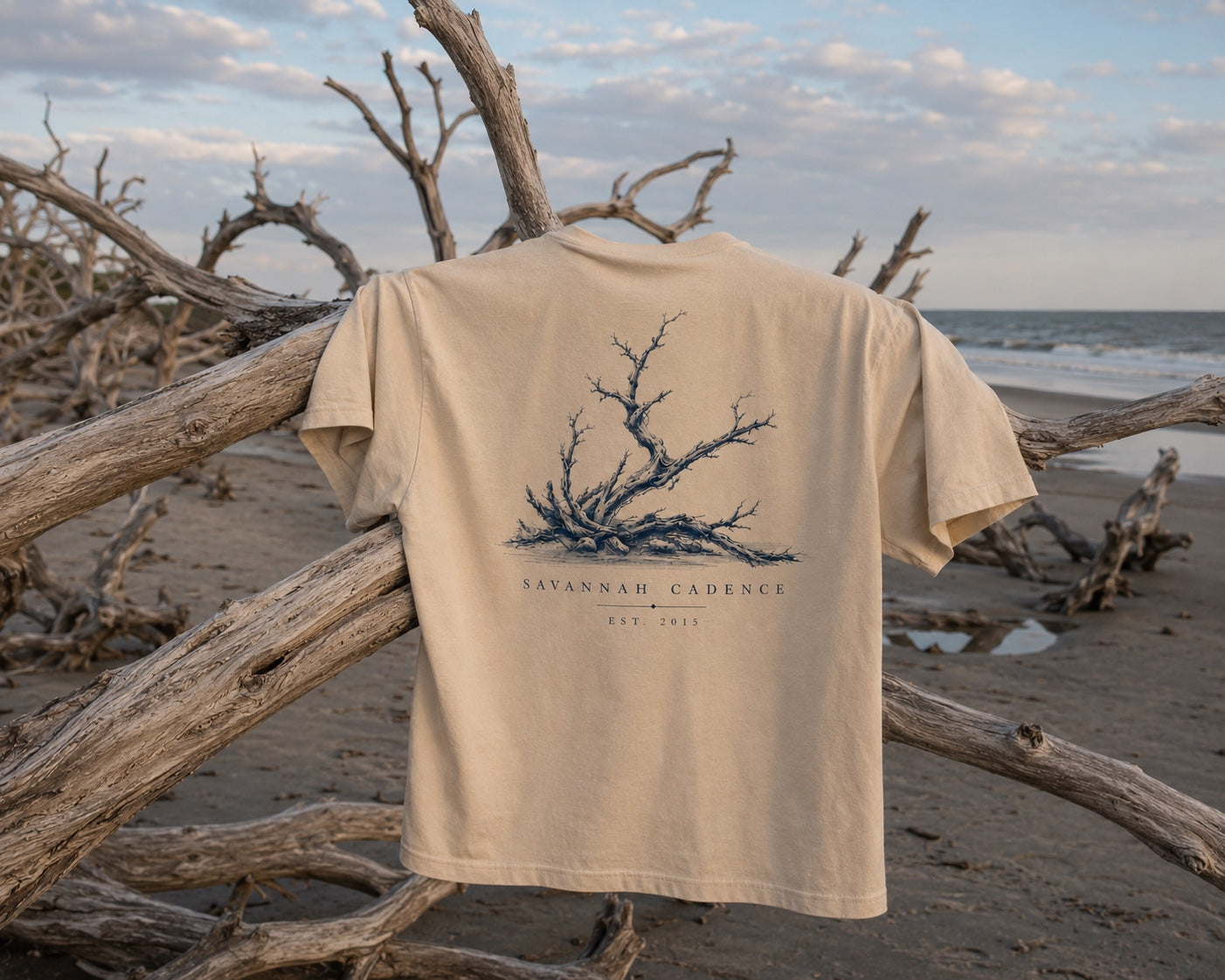 Savannah Cadence Driftwood Tee hanging on driftwood at Driftwood Beach, Jekyll Island, Georgia