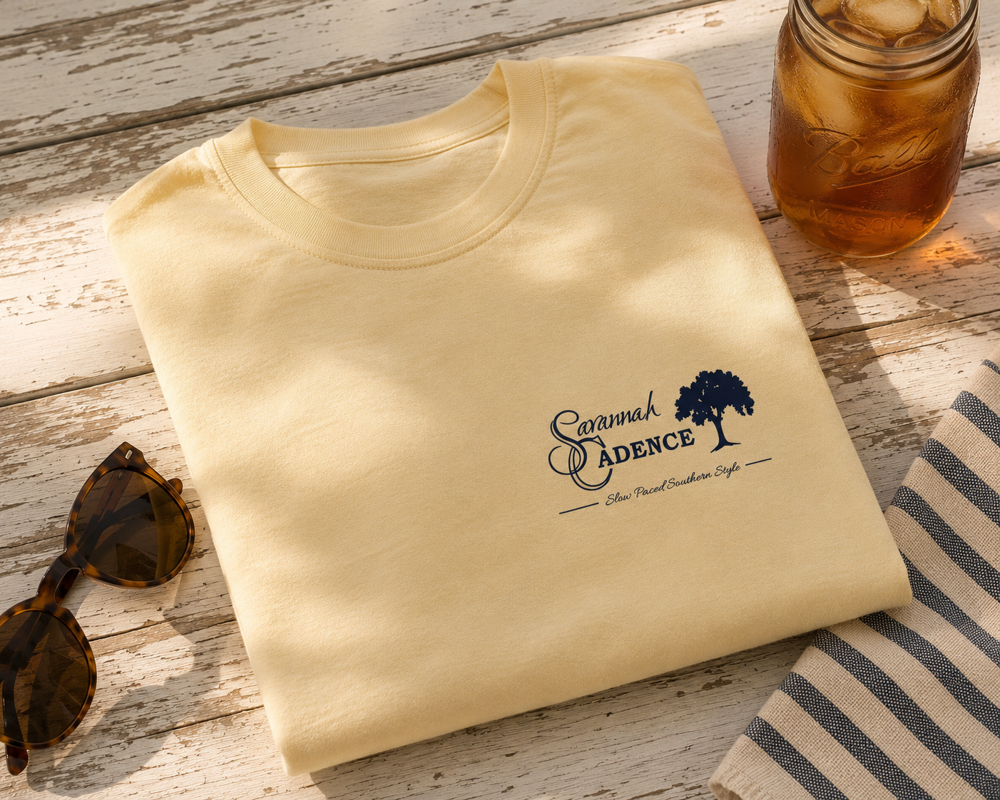 Savannah Cadence Tastes Like Home Tee displayed with Southern picnic styling and Savannah Cadence logo.